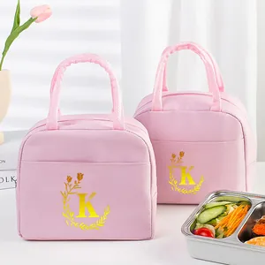 Pink insulated lunch bag with gold letter K print and elegant flower wreath motif