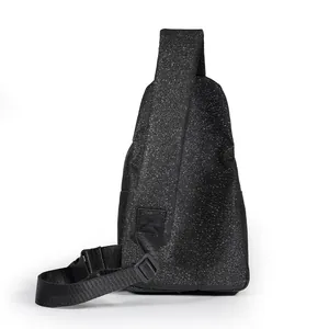 Close-up of black glitter sling bag showing sparkly texture and adjustable strap