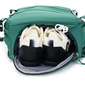 Close-up detail of green travel backpack featuring a dedicated shoe compartment for storage