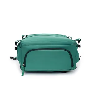 Detailed view of the bottom zipper compartment on a green large capacity travel backpack