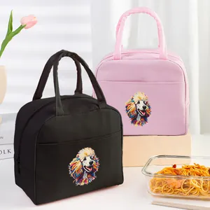 Detail view of colorful poodle print insulated lunch bags in black and pink