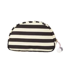 Zwart-wit gestreepte canvas make-uptas met de schattige pompon-ritsgrepen en rits