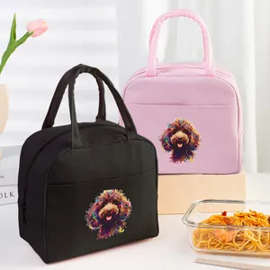 Lifestyle view of pink and black insulated lunch bags featuring a colorful dog print design