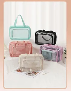 Group view of large transparent toiletry bags in five pastel colors for travel storage