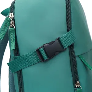 Close-up detail showing the durable side buckle and zipper of a green travel backpack