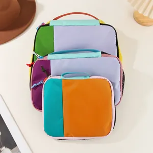 Close-up of three colorful waterproof nylon storage bags in a stylish 3-piece set.