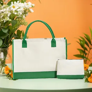 Vue détaillée de l'ensemble sac fourre-tout en toile et pochette assortie en vert