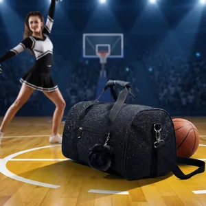 Black glittery sports duffel bag with a soft pom-pom shown on a basketball court scene