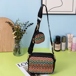 Detailed view of a woven square crossbody bag with colorful zigzag pattern