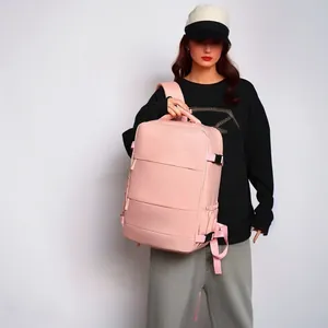 Detail view of a large pink multi-functional travel backpack carried by a model