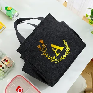 Stylish black portable insulated lunch bag featuring a yellow letter A wreath design