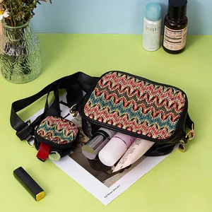 Detailed view of the woven crossbody bag set showing internal cosmetics storage space