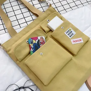 Large capacity multi-pocket canvas crossbody bag for women in mustard yellow design