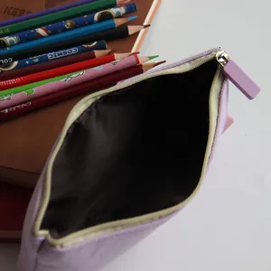 Close-up detail of the spacious interior of the purple canvas stationery pouch