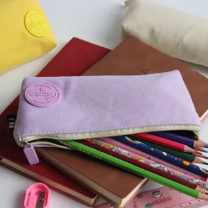 Macro view of Morandi purple canvas pencil case filled with colorful drawing pencils
