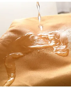 Close-up detail of waterproof fabric for thermal lunch bag showing water beads