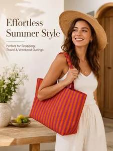 Lifestyle view of a vibrant orange and purple striped canvas tote bag worn by a model