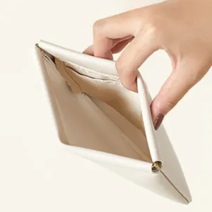 Close-up view showing the interior of an automatic closure white storage pouch.
