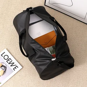 Detailed view of spacious interior of black waterproof gym bag with items