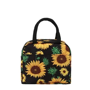 Sac à lunch isotherme orné d'un motif tournesol éclatant sur fond noir.