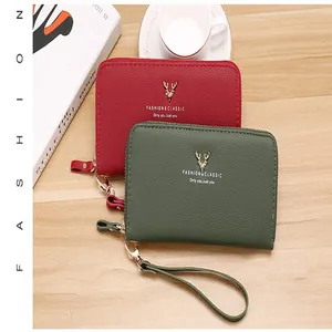Detailed view of red and green lychee pattern clutch wallets with golden deer logo
