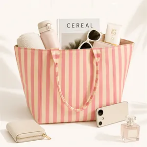 Large capacity pink striped canvas tote bag for women, perfect for travel and beach use.