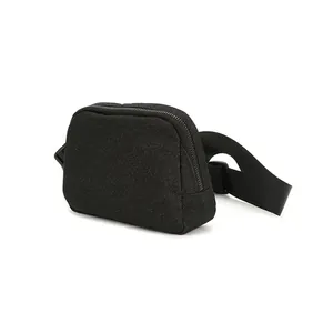 Close-up detail of black glitter belt bag showing adjustable strap and zipper closure