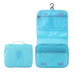 Blue hanging travel toiletry bag detail showing internal pockets and closed view
