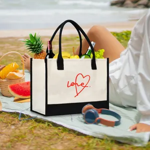 Large capacity canvas tote bag with 'Love' heart print in a beach picnic scene