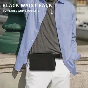 Detail of shimmering black waist pack worn with casual outfit outdoors