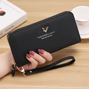 Black pebble leather long zipper wallet for women featuring elegant golden deer logo.
