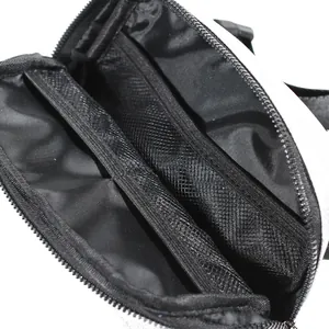 Interior view of glitter waist bag showing multiple zipper compartments and mesh pockets