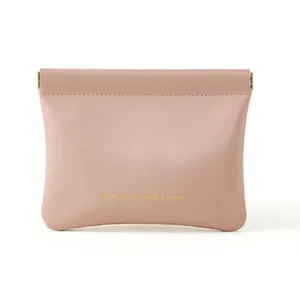 Small pink leather storage pouch with spring closure and gold lettering