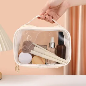 Large capacity transparent cosmetic bag with woven handle and makeup brushes inside