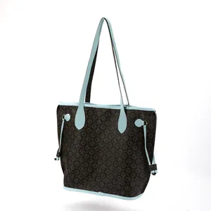 Detailed view of a stylish brown monogram tote bag with elegant light blue accents.