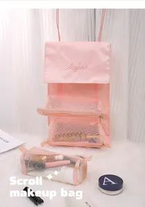Detachable 4-in-1 pink travel makeup bag showing mesh compartments and hanging design