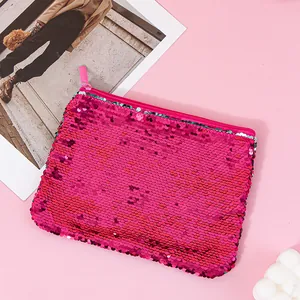 Close-up of vibrant pink reversible mermaid sequin makeup pouch with smooth zip closure
