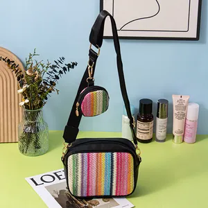 Detail showing the vibrant woven texture of the square crossbody bag and matching round pouch.