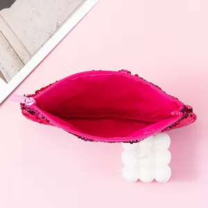 Detailed interior view of a vibrant pink mermaid sequin pouch with smooth fabric lining