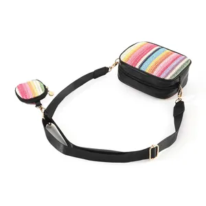Detailed view of woven crossbody bag set with colorful stripes and matching mini pouch