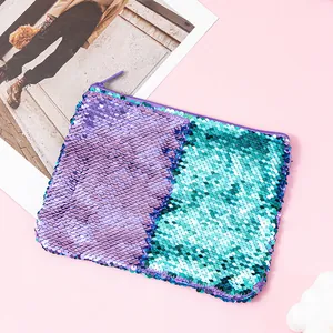 Detail view of purple and teal reversible mermaid sequins on a portable zipper pouch