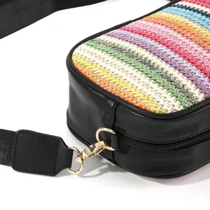 Detailed view showing the colorful rainbow weave and gold hardware of this crossbody bag