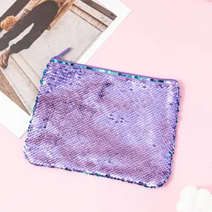 Detail view of a reversible purple mermaid sequin pouch with a shimmering texture