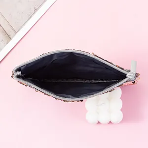 Detailed view of the interior lining and flip sequins of this mermaid style storage pouch