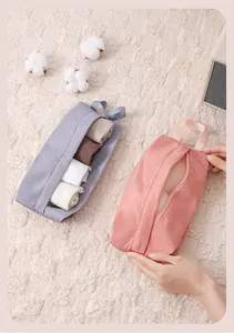 Detailed view of portable travel storage bags showing organized socks and underwear