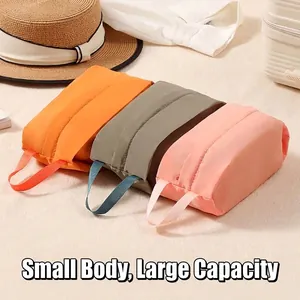 Portable waterproof travel storage bags for clothes and toiletries in three colors