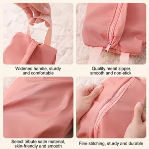 Portable pink satin travel storage bag for underwear and cosmetics with sturdy handles