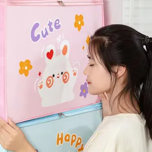 Close-up view of cute cartoon non-woven storage bags for clothes and quilts