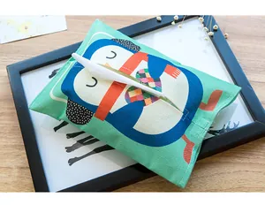 Cute cartoon penguin pattern fabric tissue box cover with linen-like texture in detail view