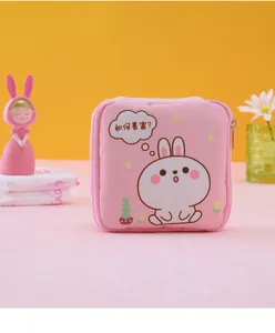 Detailed view of pink cartoon rabbit storage bag for feminine hygiene products with zipper